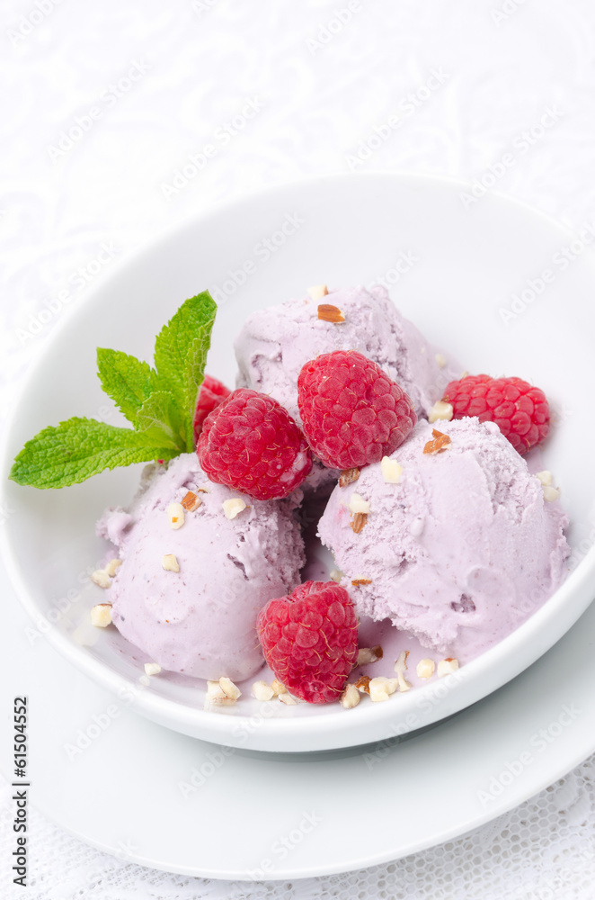 ice cream with fresh raspberries in a bowl close-up vertical ice cream with fresh raspberries in a bowl close-up vertical