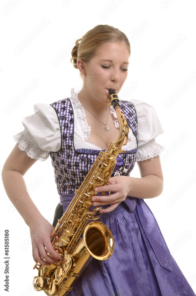 Fototapeta premium Frau im Dirndl spielt Saxophon
