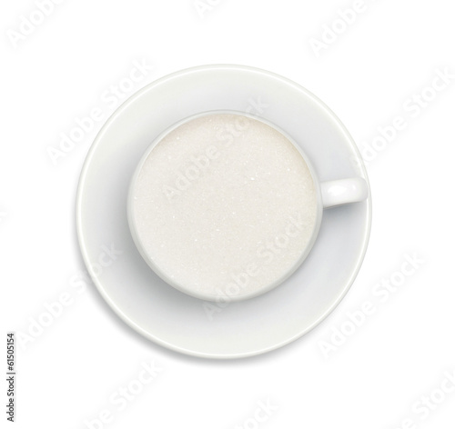 sugar in a white coffee cup and saucer isolated on white