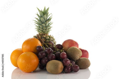 fruit as oranges pineapple grapes and kiwi