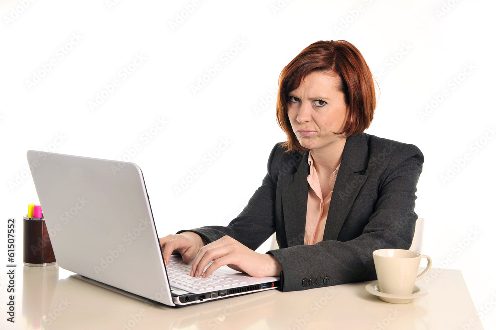 bored business red haired woman in stress at work with laptop bored business red haired woman in stress at work with laptop