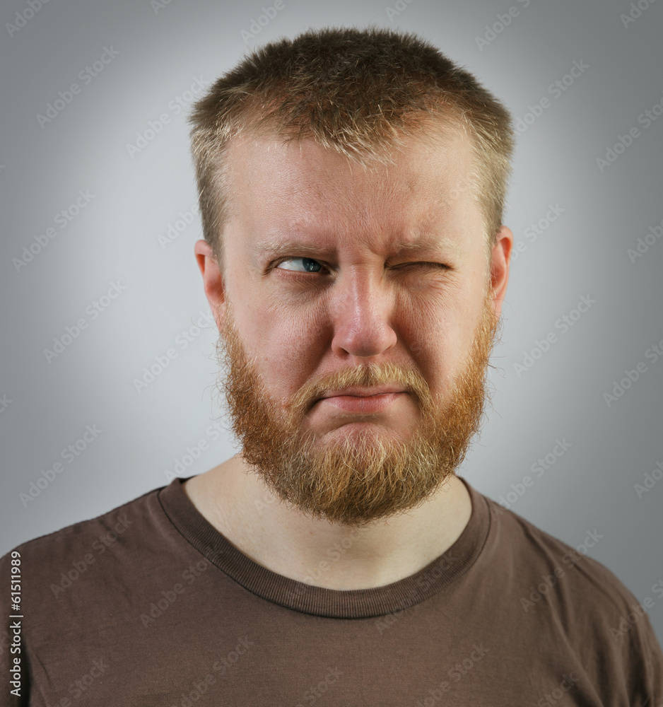 Fototapeta premium Man looking off to the side with one eye