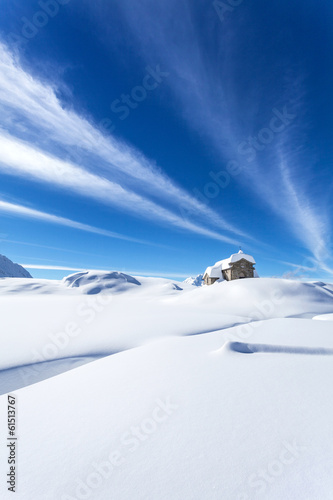 chiesetta alpina con neve photo