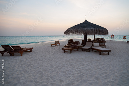 Beach with lounger umbrella and seascape