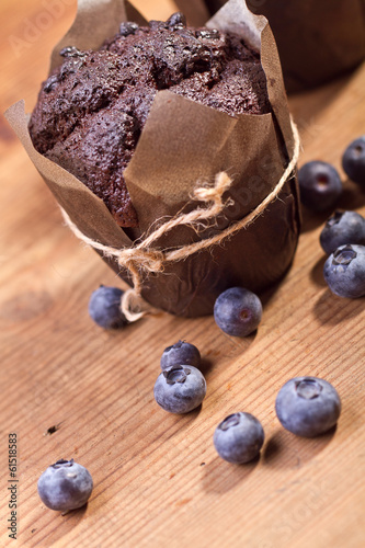Homemade blueberry muffins in paper cupcake holder 