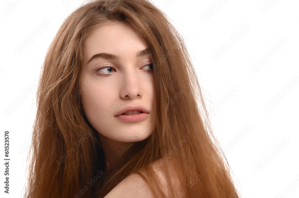 Young woman looking back over her shoulder.Girl looking behind. Young woman looking back over her shoulder.Girl looking behind.