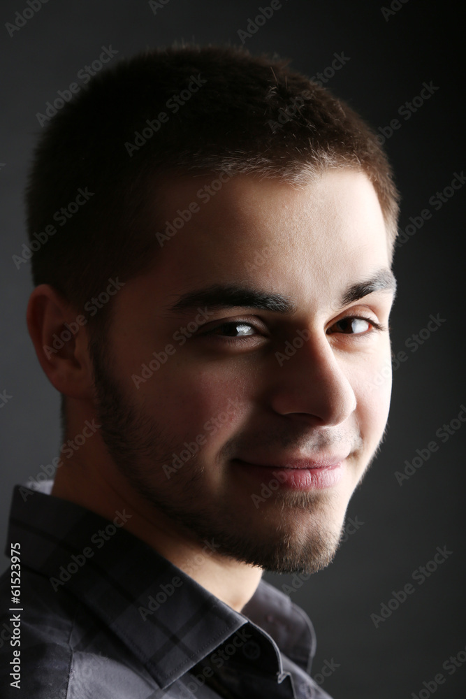 Handsome young man on dark background Handsome young man on dark background