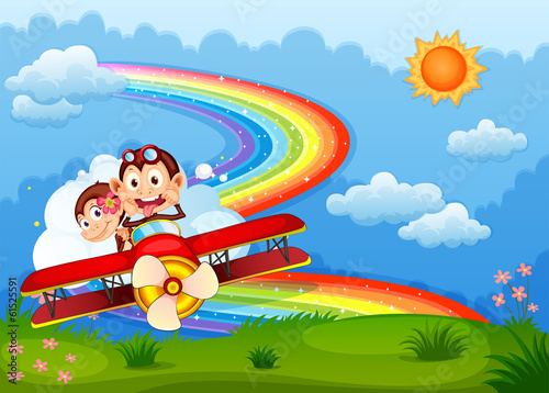 A plane with two boastful monkeys and a rainbow in the sky