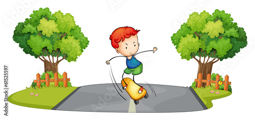 A boy skateboarding at the street