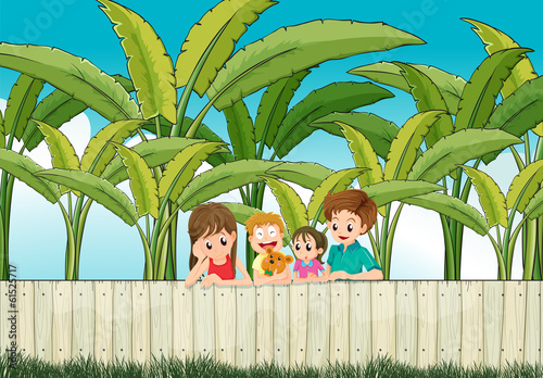 A sad mother with her family at the fence
