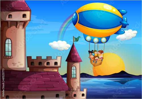 A floating balloon with kids going to the castle