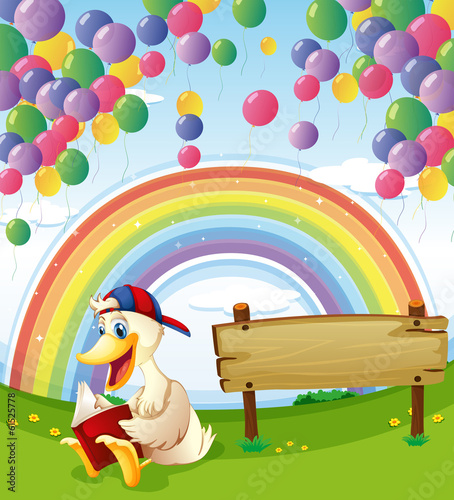 A duck beside the wooden board with floating balloons and a rain