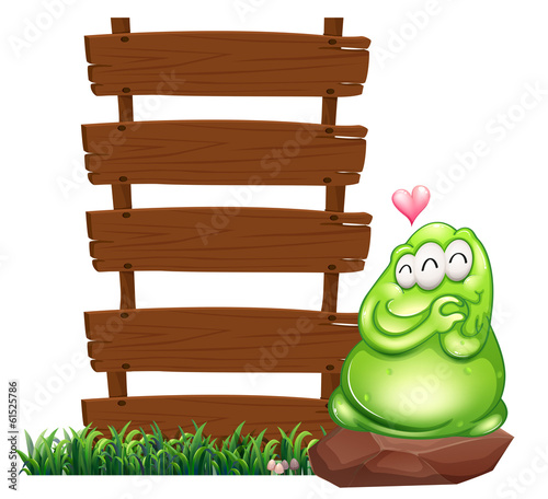 A green monster beside the empty wooden boards