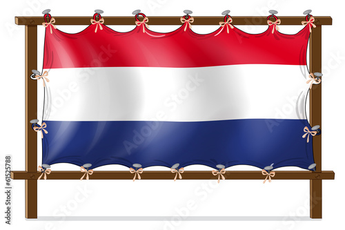 The flag of Netherlands attached to the wooden frame