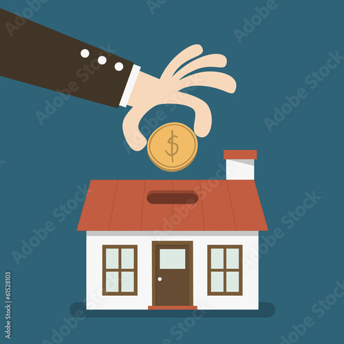 business hand saving money in a House shaped piggy bank