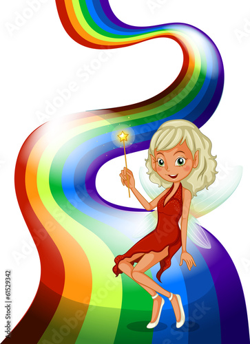 A smiling fairy above the rainbow