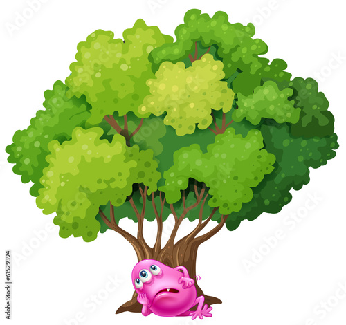 A pink monster resting under the tree