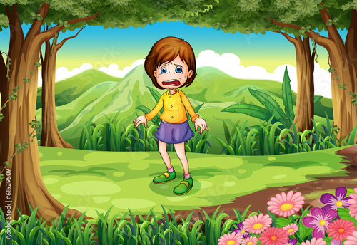 A scared young girl at the forest