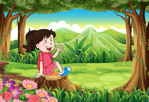 A young girl sitting above the stump at the forest