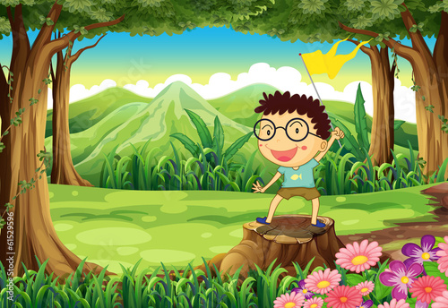 A boy above the stump holding a yellow banner