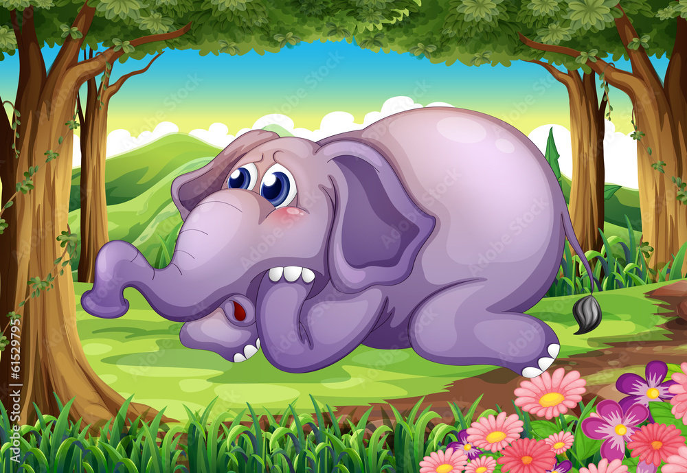 Fototapeta premium A sad elephant at the forest