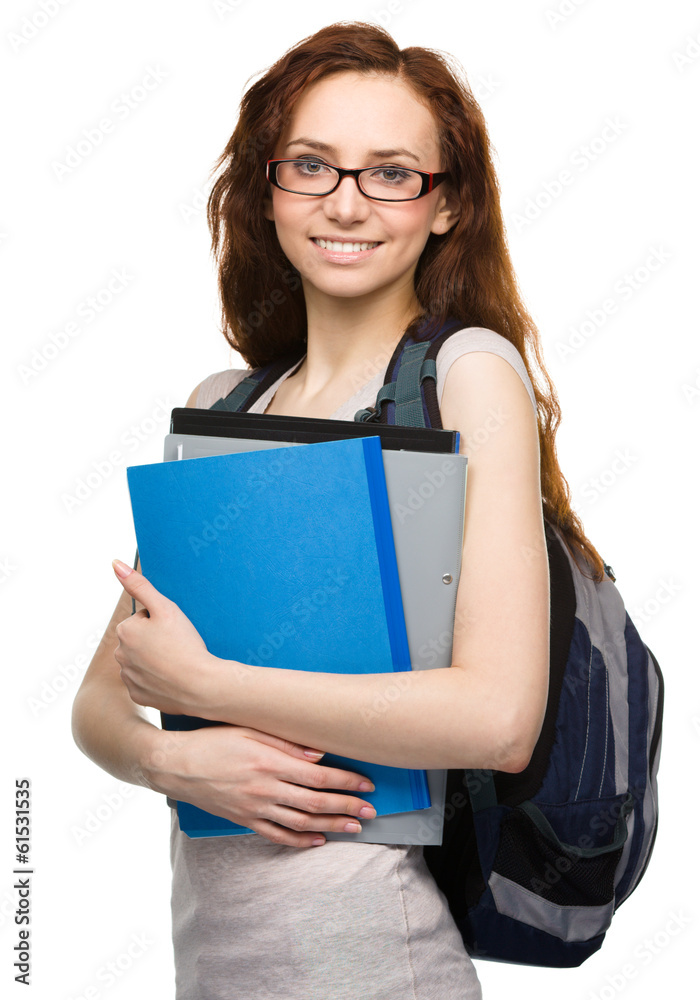 Young student girl is holding book Young student girl is holding book