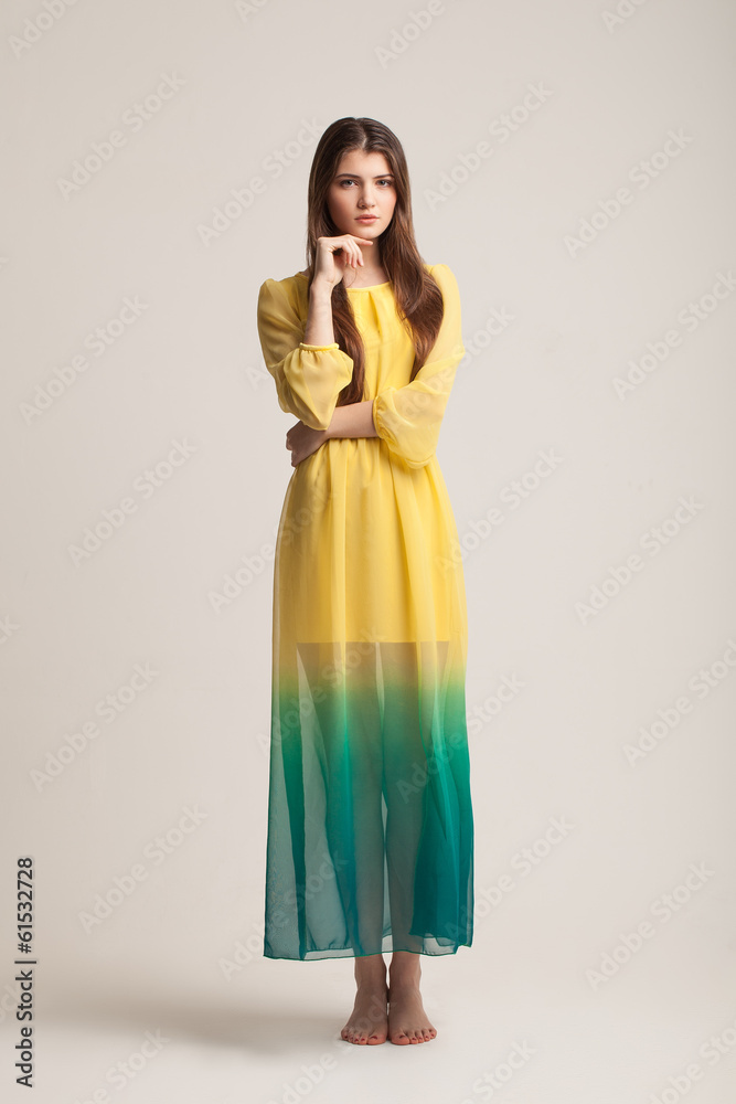 The young girl poses in studio. Clothes advertizing. The young girl poses in studio. Clothes advertizing.