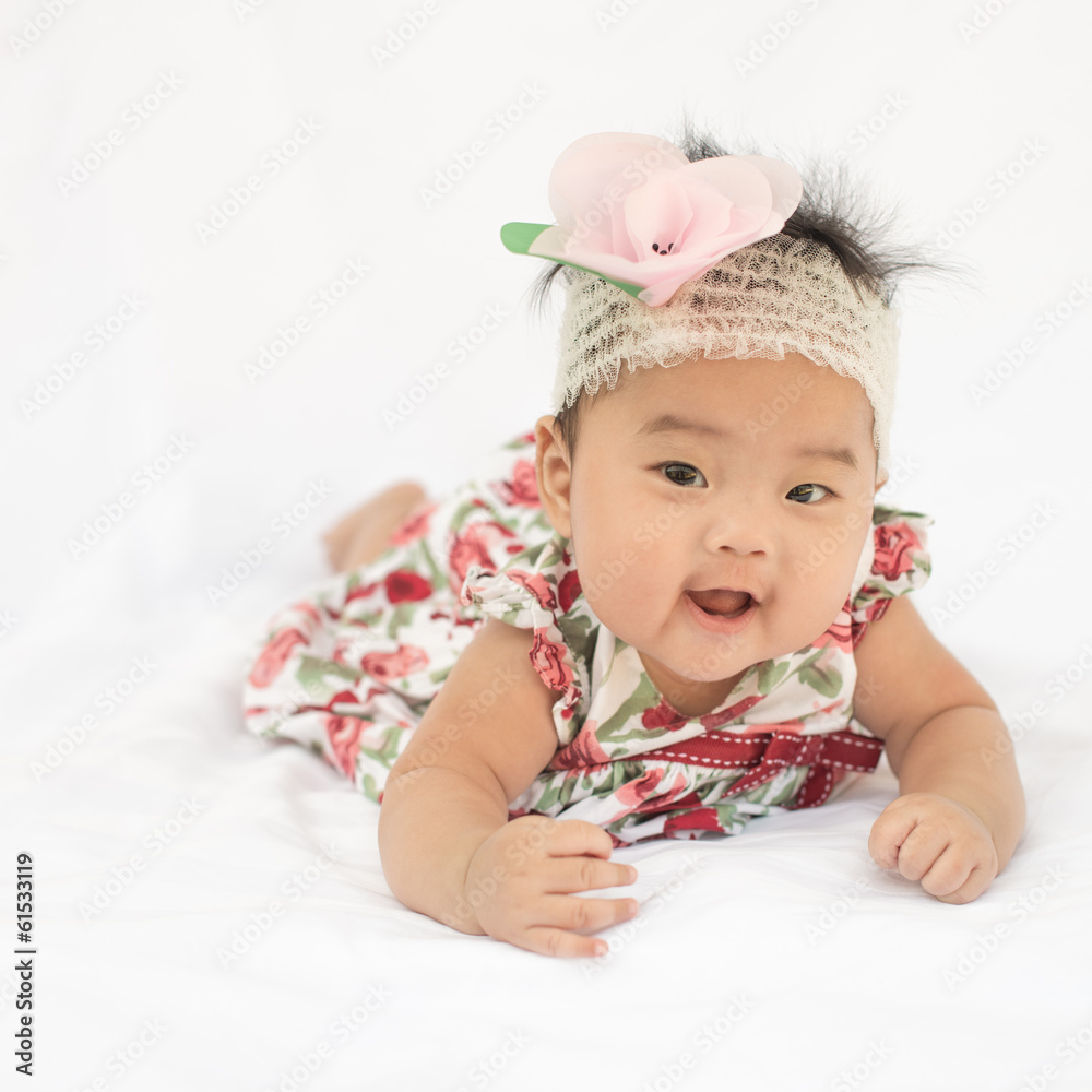 Cute baby smiling girl with rose headband Cute baby smiling girl with rose headband
