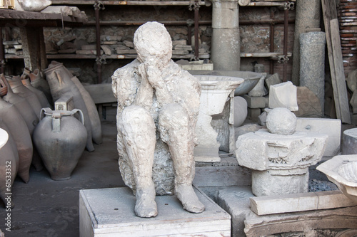 Pompei man with hands covering face, Pompeii