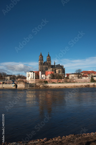 Magnificent Cathedral of Magdeburg at river Elbe with blue sky, © neurobite