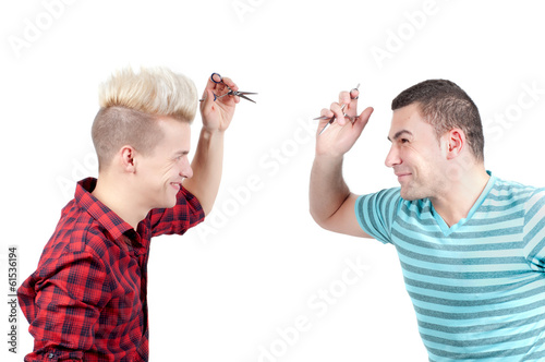 Cuadro en lienzo Two men with scissors aiming each other