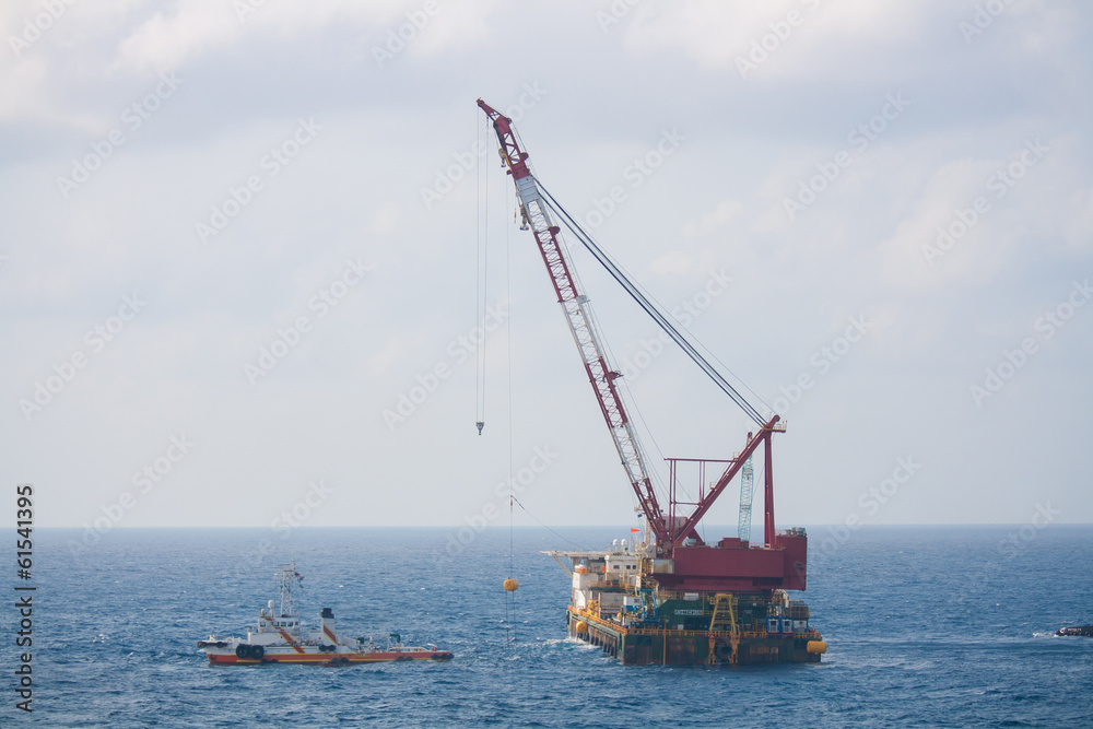 Fototapeta premium crane barge doing marine heavy lift installation