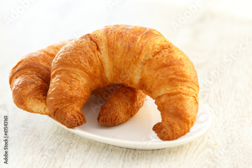 Two delicious croissants on a plate