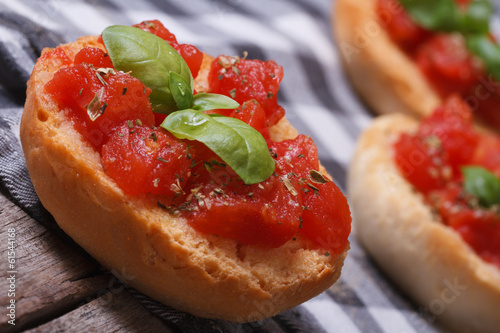 Bruschetta with tomatoes and basil close-up