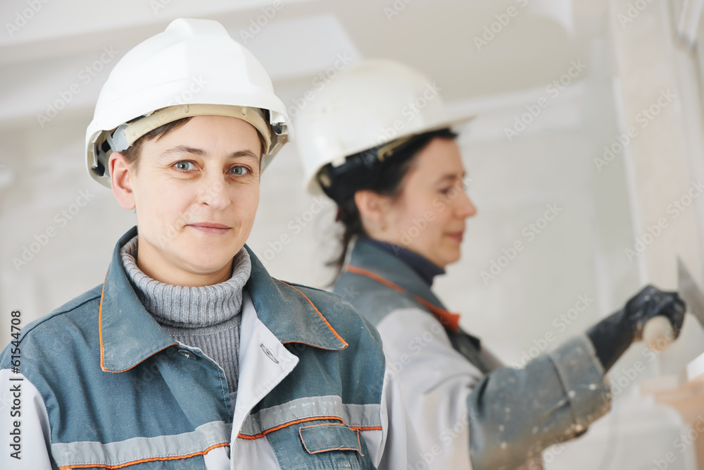 Plasterer at indoor wall work Plasterer at indoor wall work