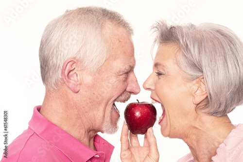 Senior couple with apple #61548301