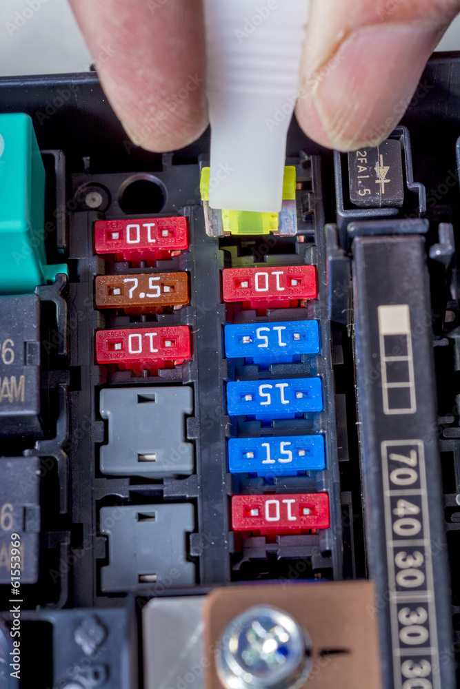 automotive fuse is replaced in car engine Stock Photo Adobe Stock