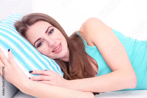 Young woman resting on sofa at home