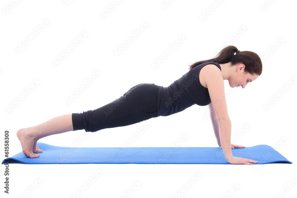 young woman doing push up exercise isolated on white young woman doing push up exercise isolated on white