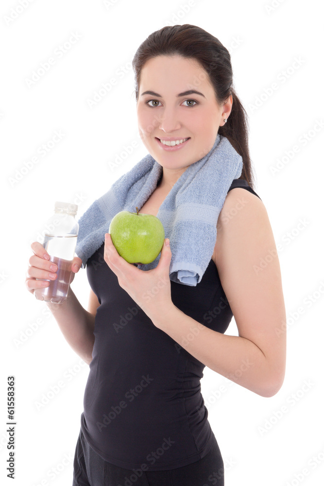 young sporty woman with bottle of mineral water and apple isolat young sporty woman with bottle of mineral water and apple isolat