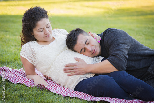 Pregnant Hispanic Couple in The Park Outdoors © Andy Dean
