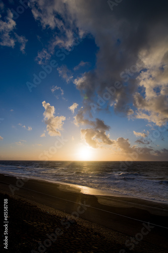 sunset and cloudscape above the dutch sea