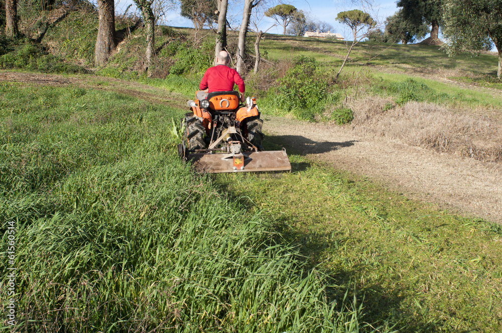 Obraz premium Tractor with mower