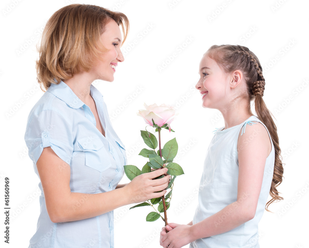 Mother giving the white rose to her little daughter Mother giving the white rose to her little daughter