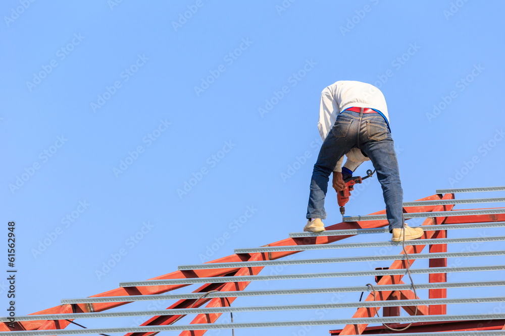 labor working in construction site for roof prepare