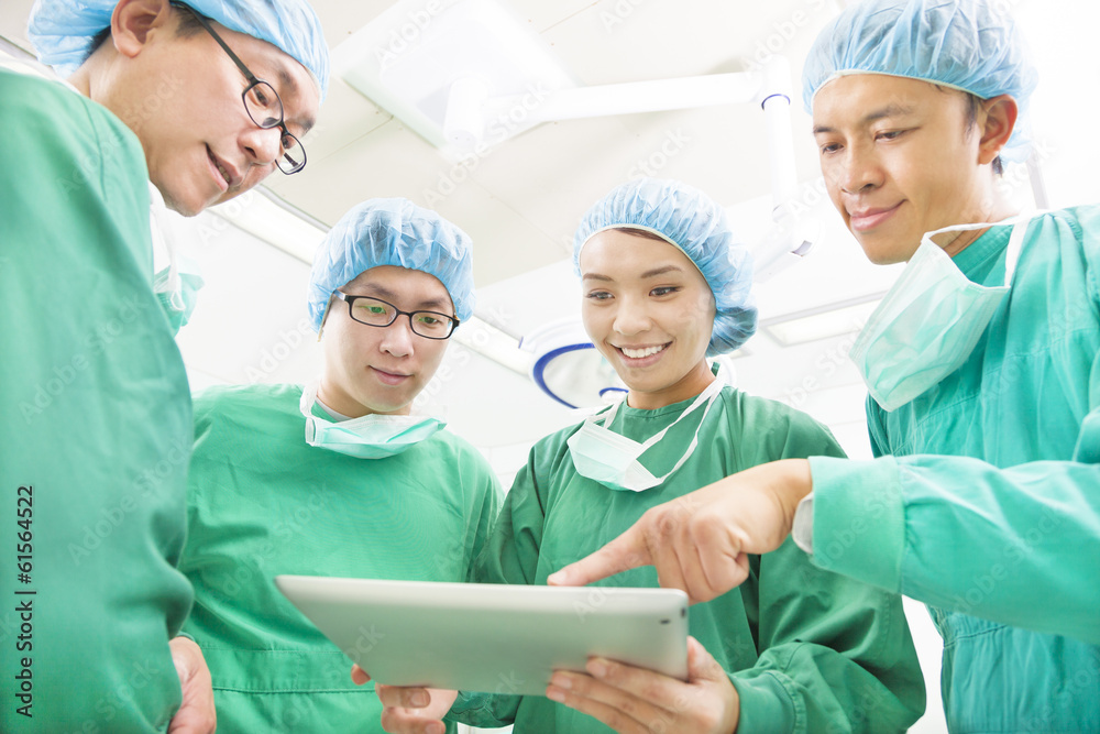 happy Surgeons discussing success operating procedure happy Surgeons discussing success operating procedure
