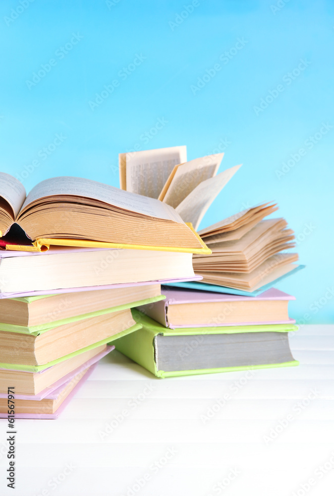 Stacks of books on table on natural background Stacks of books on table on natural background