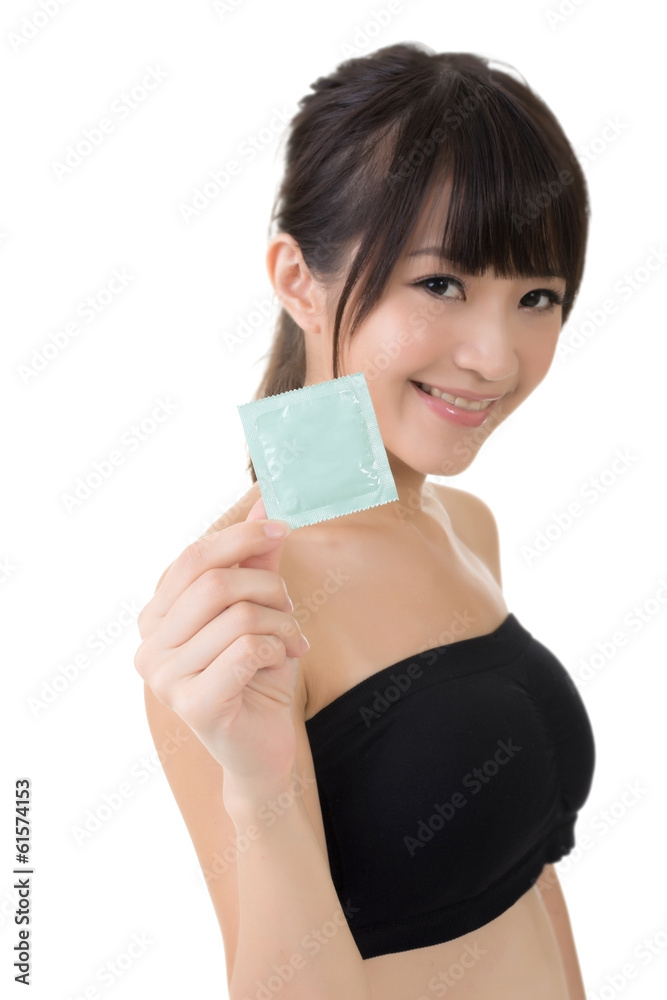 Young pretty asian woman with a condom Young pretty asian woman with a condom