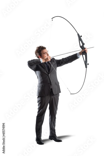 Businessman with bow and arrow