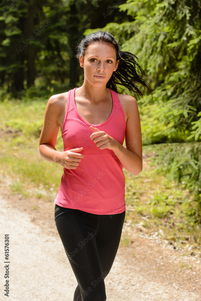 Woman jogging outdoor running on sunny day Woman jogging outdoor running on sunny day